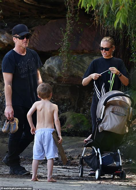 Lara Bingle and her husband Sam Worthington enjoy a beach .